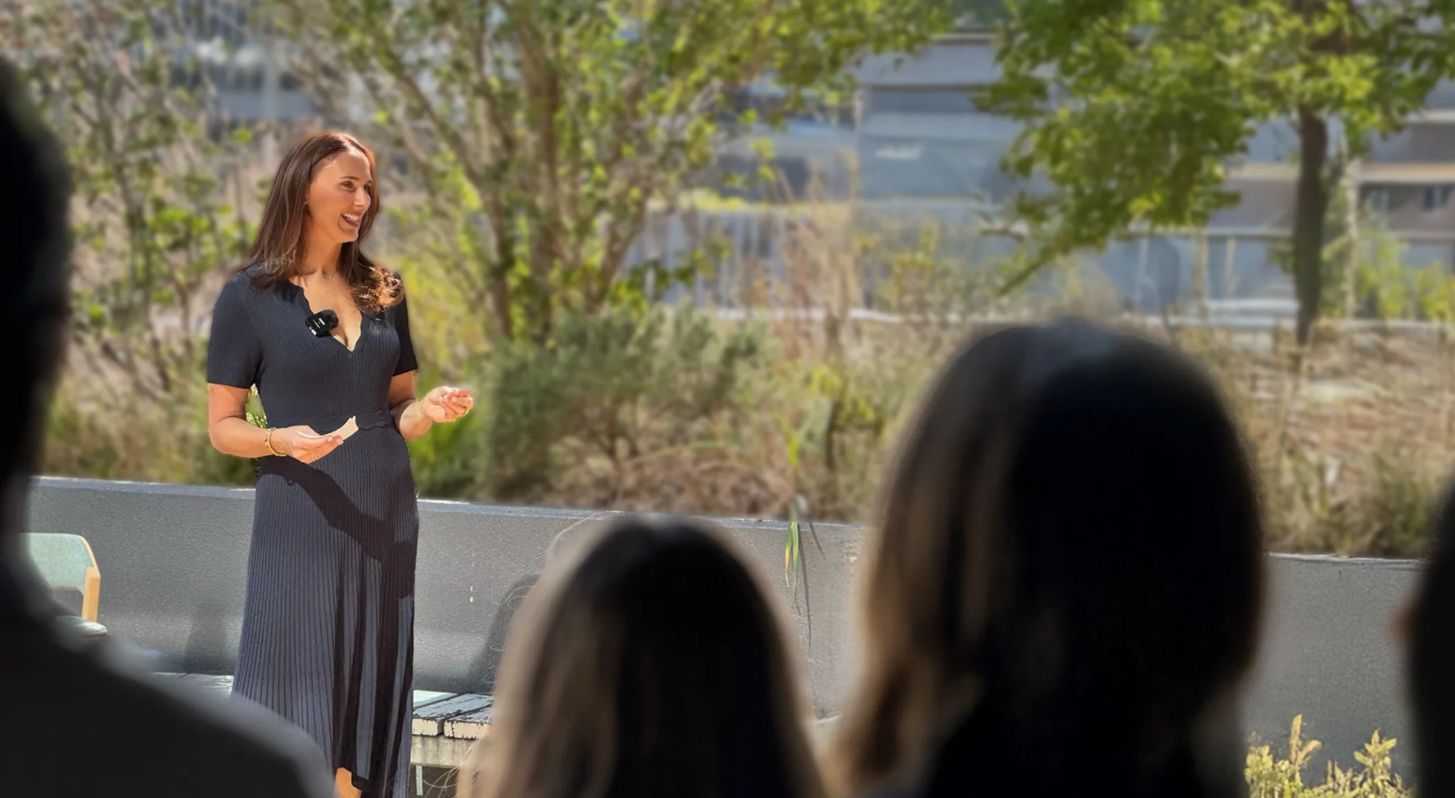 Lucy Quick, Founder of The Balanced Elite, holding a keynote presentation about workplace wellbeing, balance and burnout prevention in the workplace.