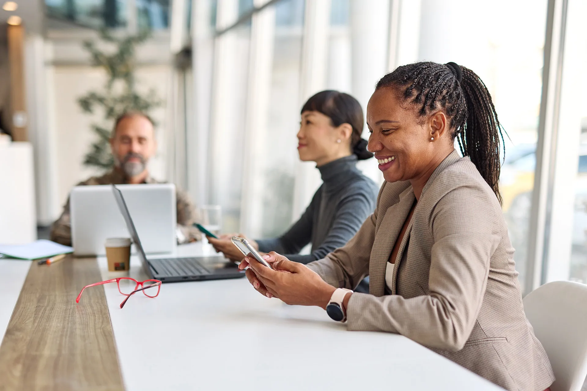 A boar room meeting where two women are feeling confident in leading.
