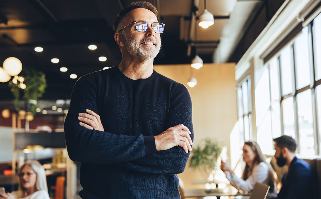 Mature businessman looking away thoughtfully