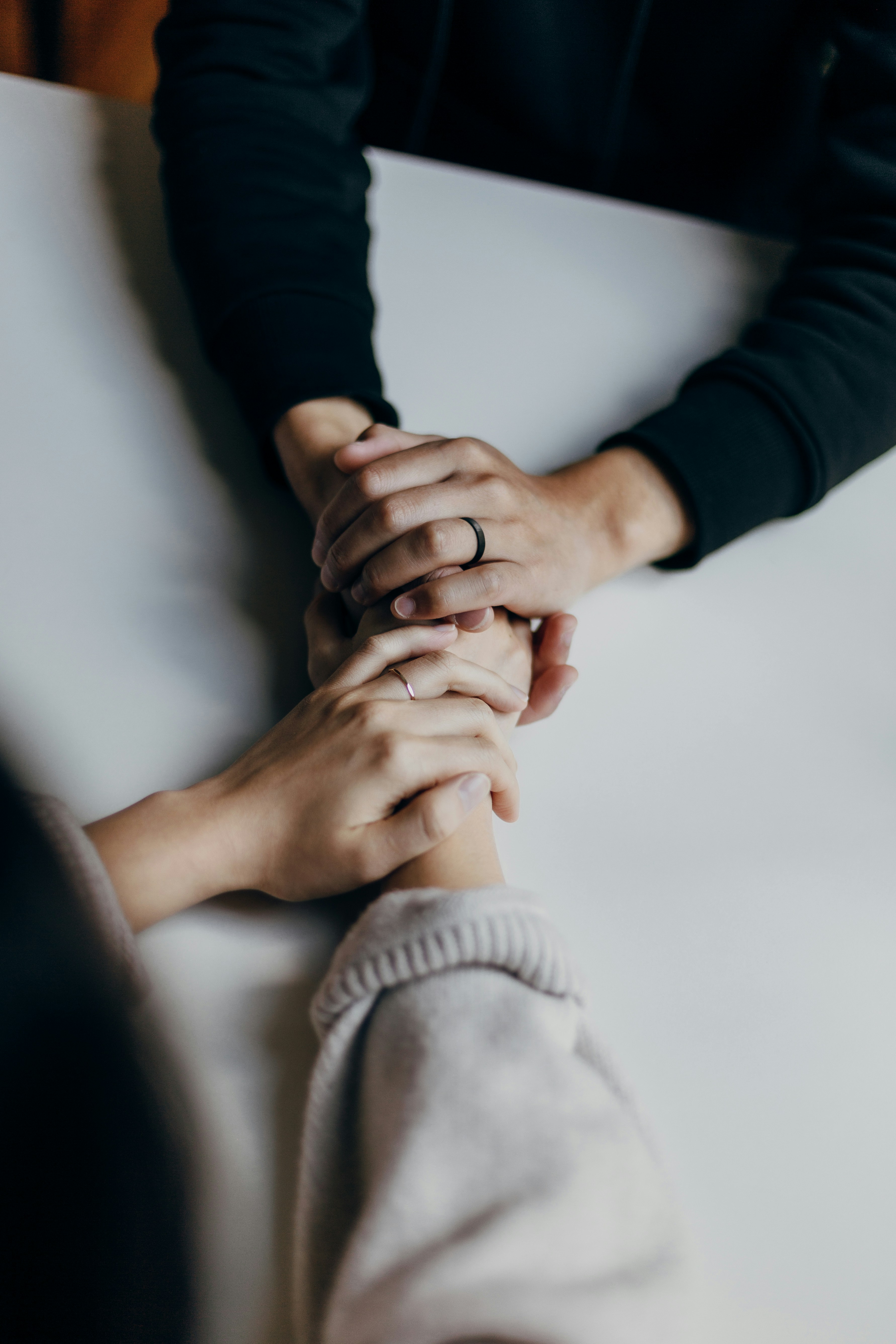 hands holding in support