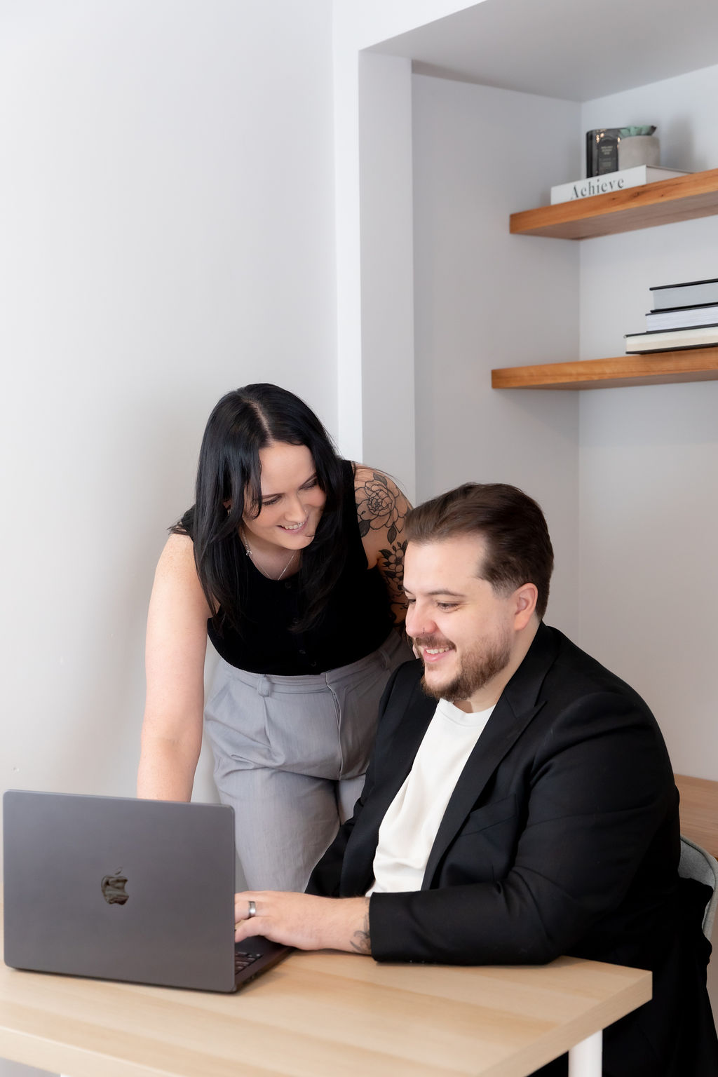 Alice Xerri, Founder and Fractional Content Lead, Freelance Copywriter for Finance, B2B Tech and SaaS, showing client work on laptop.