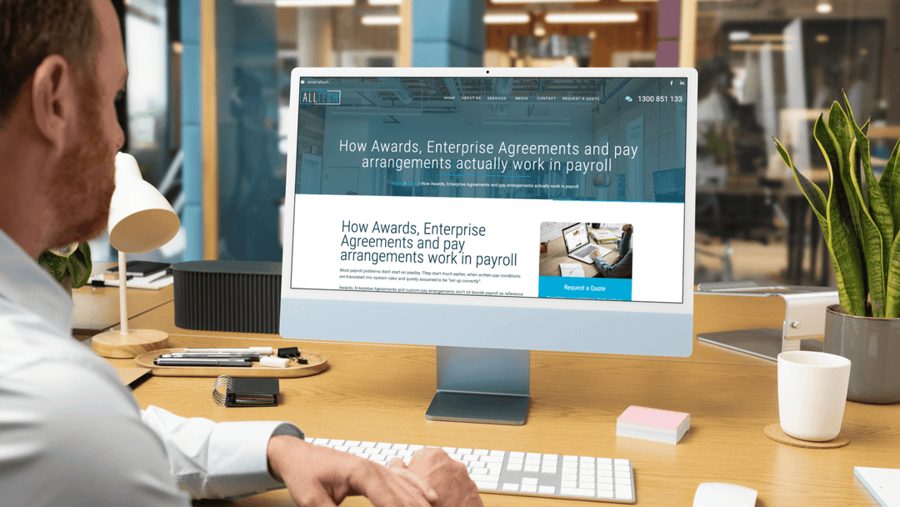 Alltech Payroll article on awards and enterprise agreements shown on a desktop screen