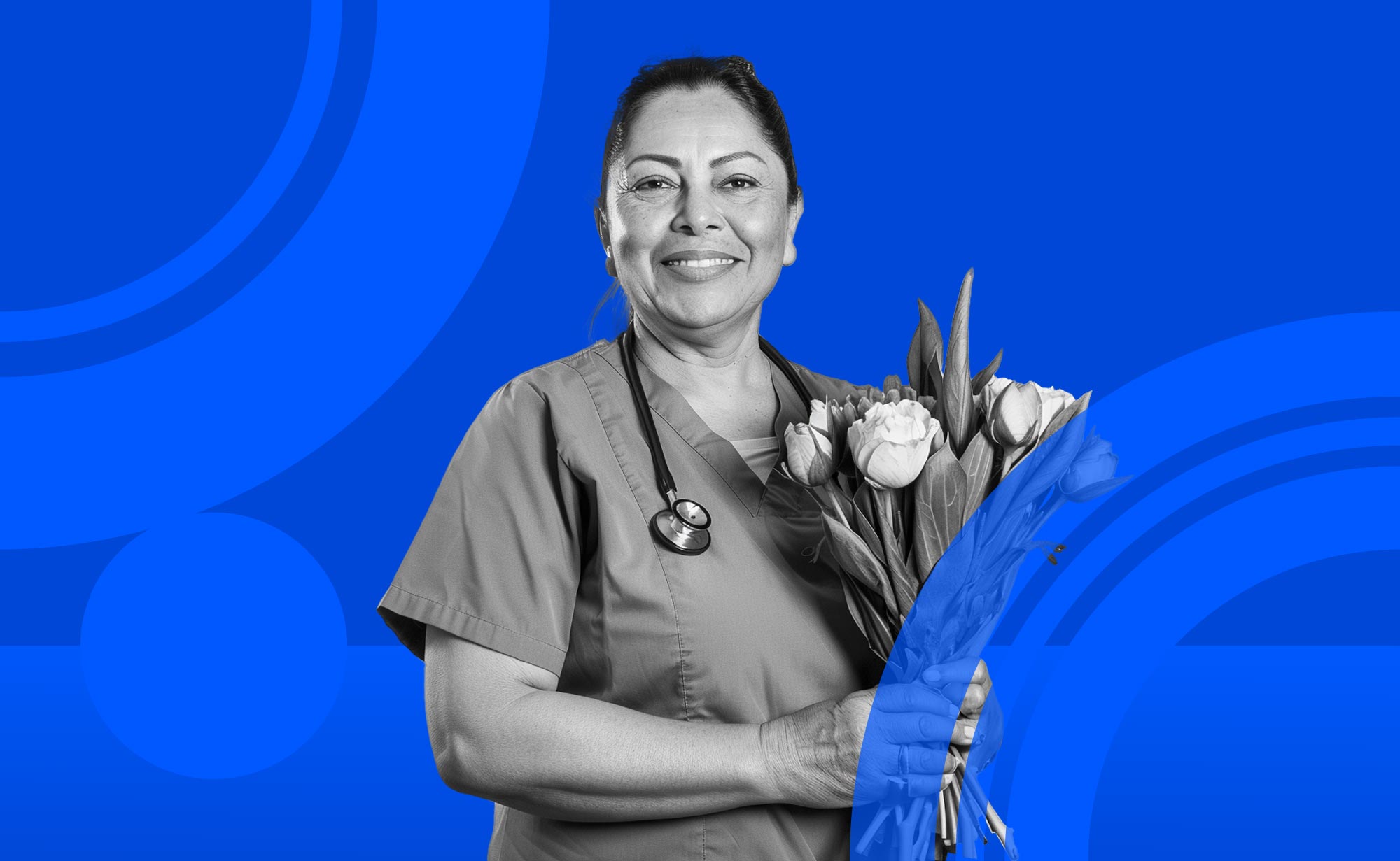 Nurse holding flowers in front of a decorative background.