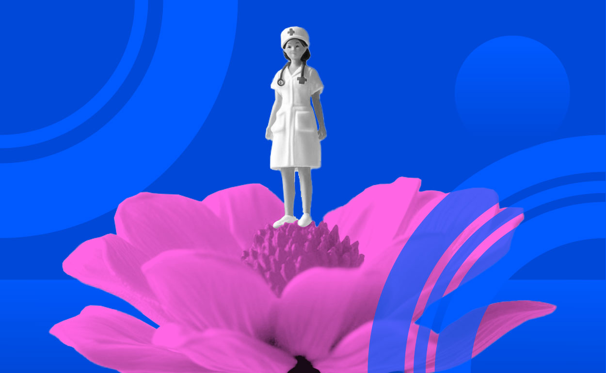 Toy nurse standing in a pink flower