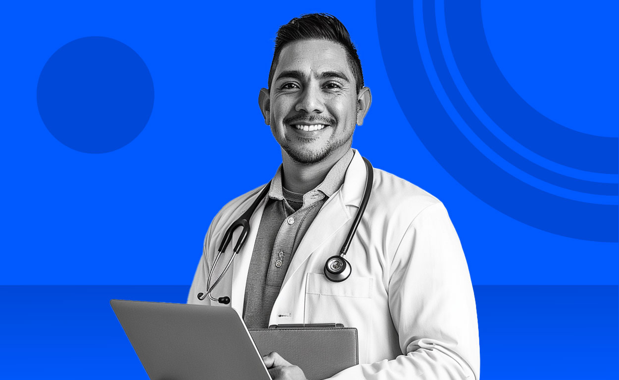 Smiling doctor with laptop.