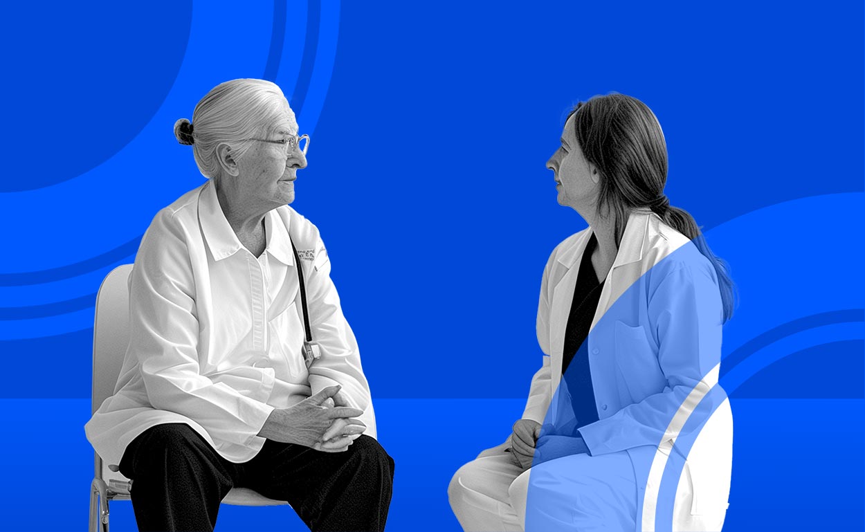 Occupational therapist conferring with elderly patient.