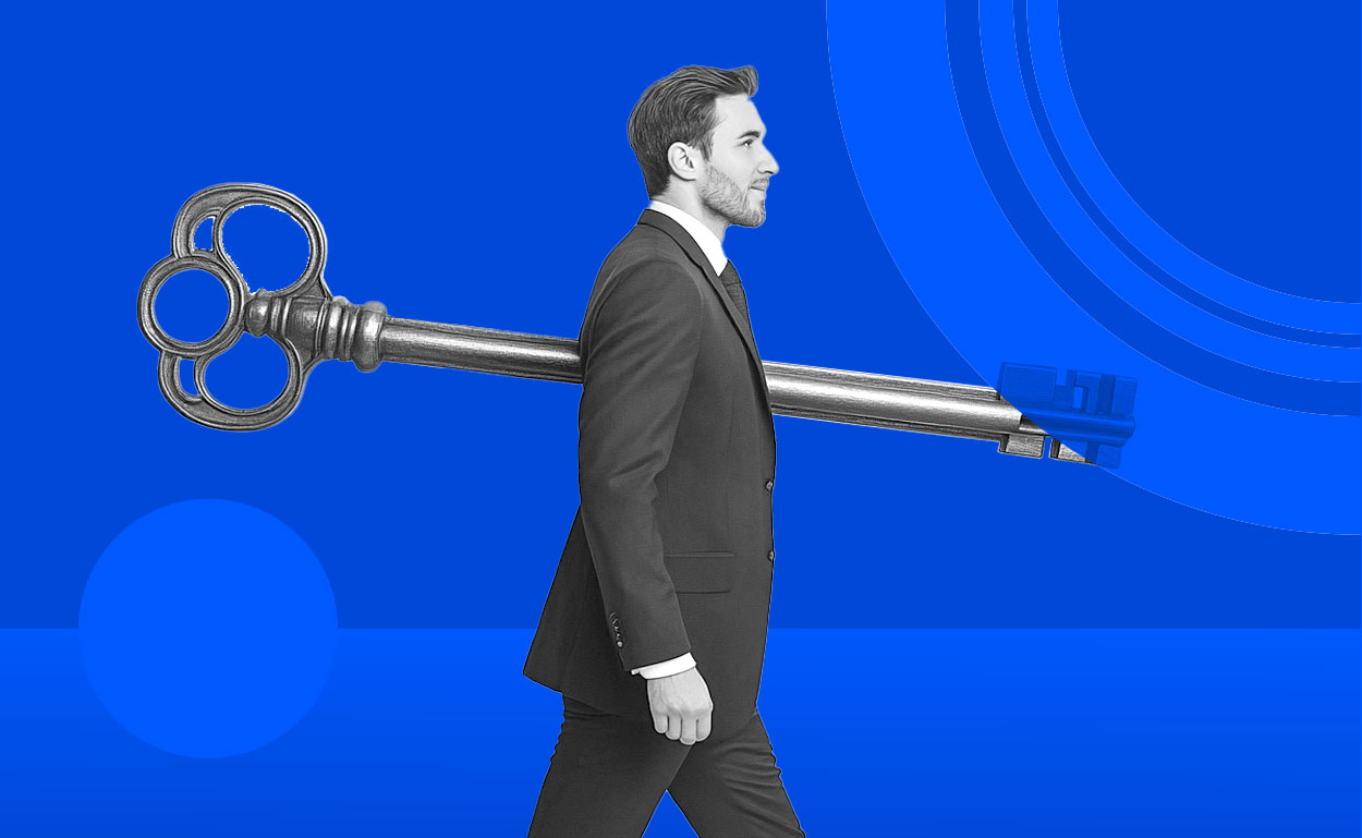 Business man carrying large key