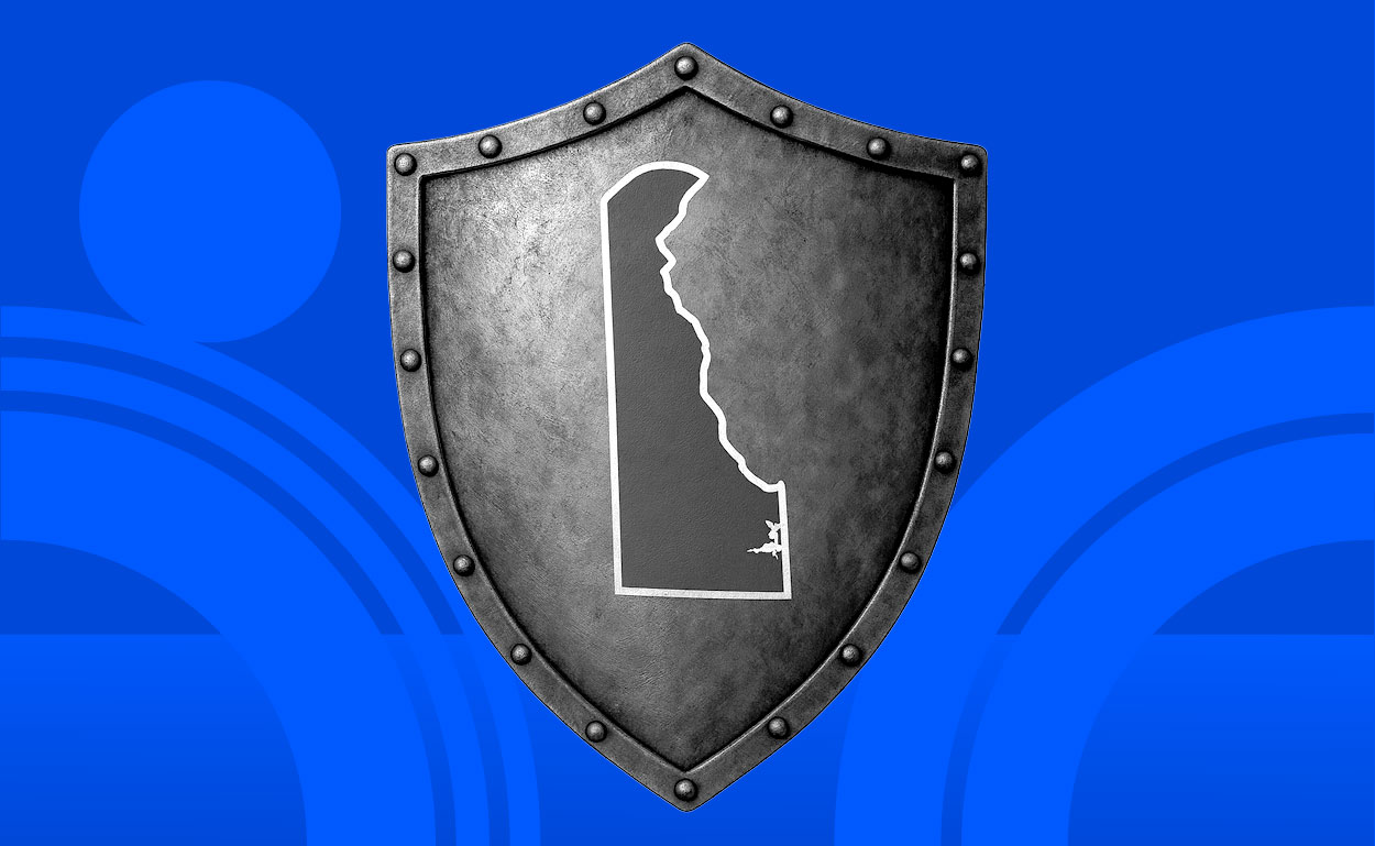 Metal shield with map of Delaware painted on it.
