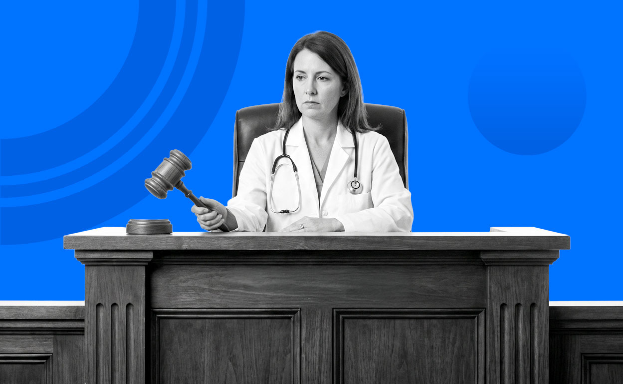 Doctor sits at judges bench