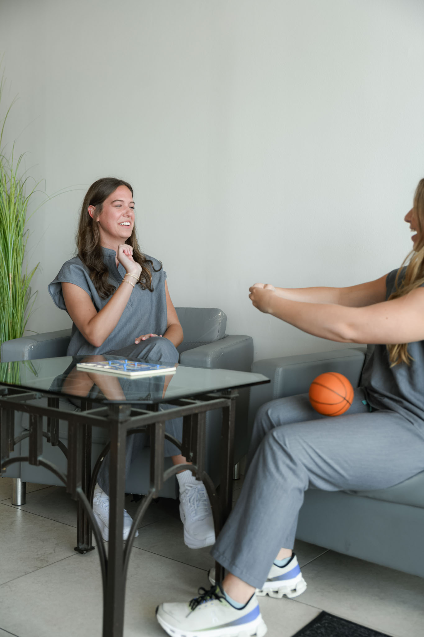 pediatric therapists modeling a game