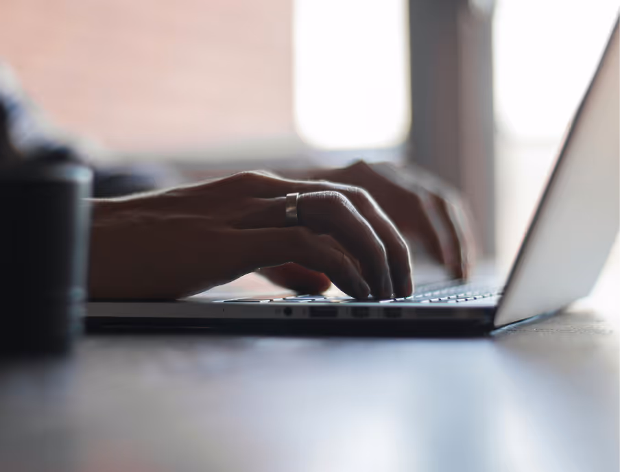 typing on laptop