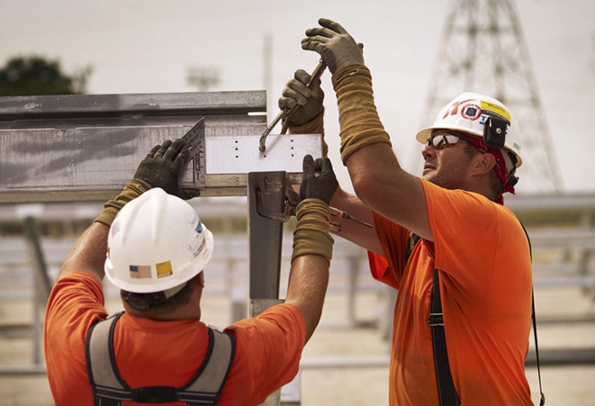 Workers repairing energy equipment