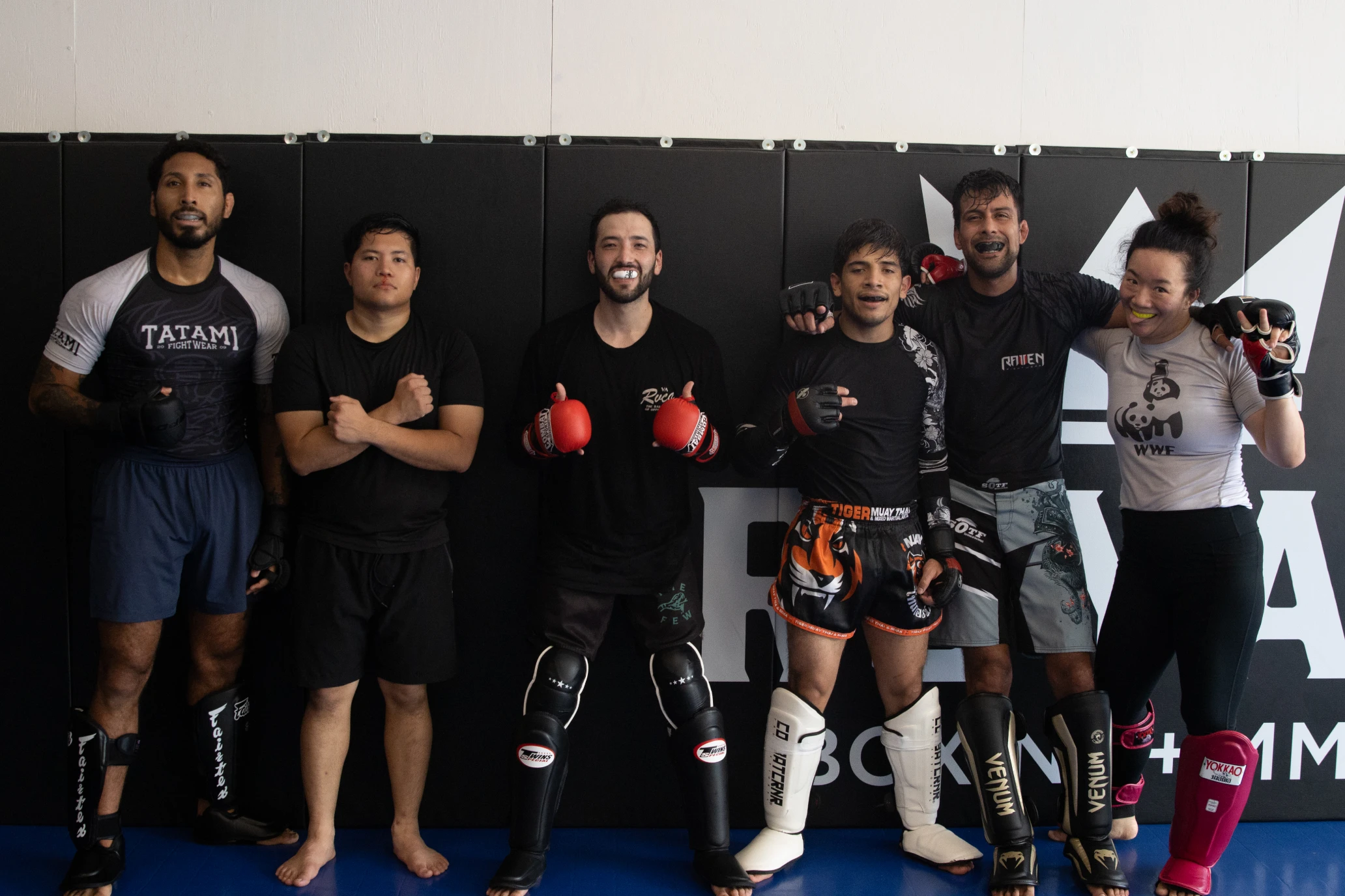 Group of athletes pose together after sparring at Royal Boxing + MMA.