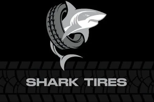 Logo for Shark Tires featuring a shark and tire design against a black background.
