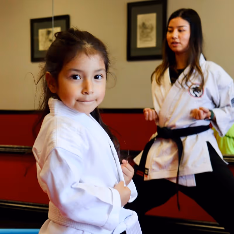 A young karate student stands ready to begin his Tiny Tigers karate class at Costa Mesa.
