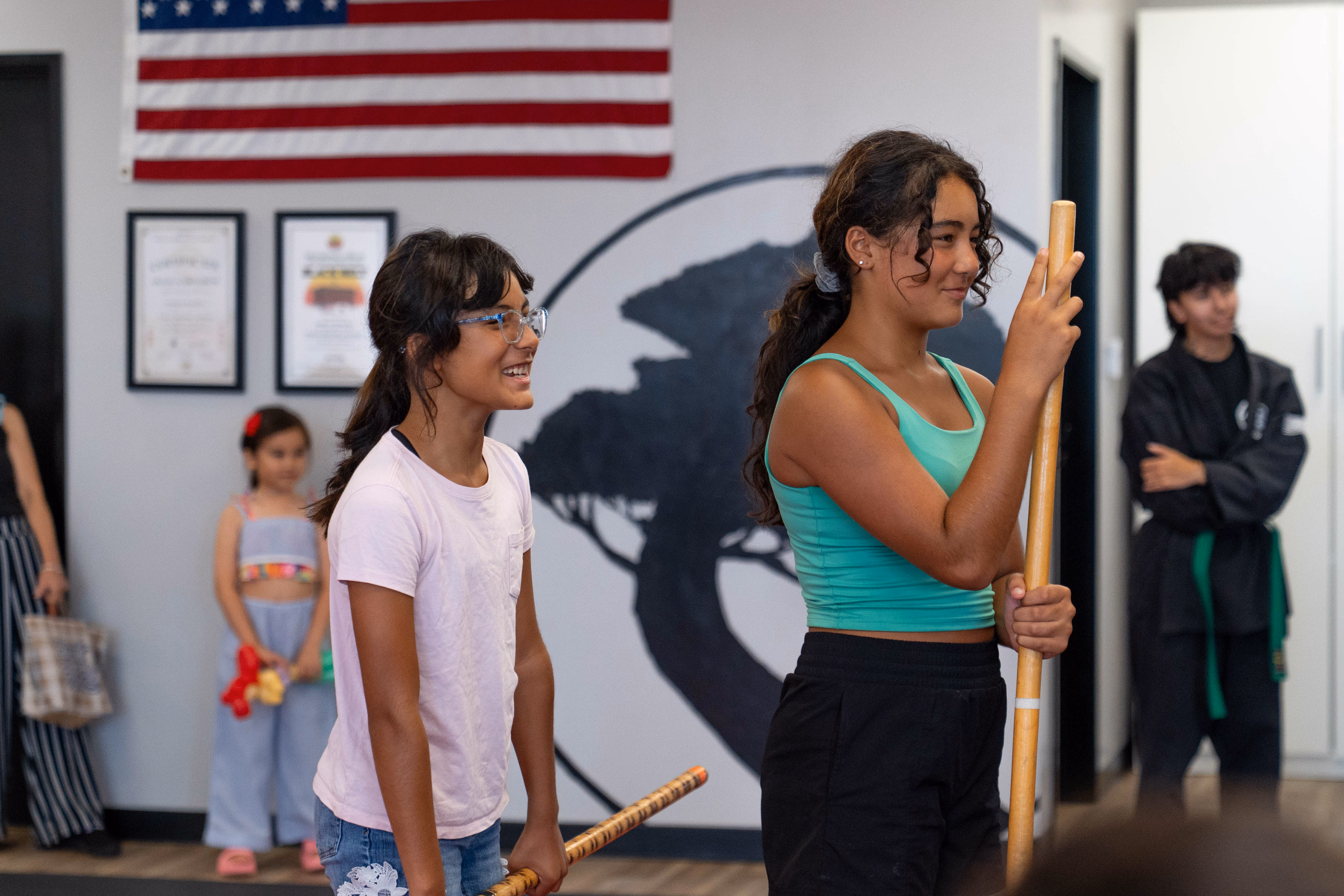 Two teen self defense students in USSD Costa Mesa practicing weapons defense.