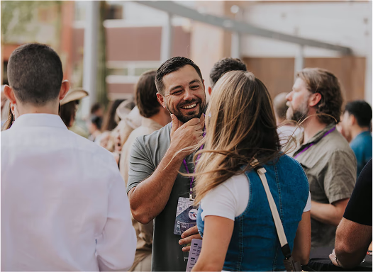A group of Flex employees laughing at an offsite