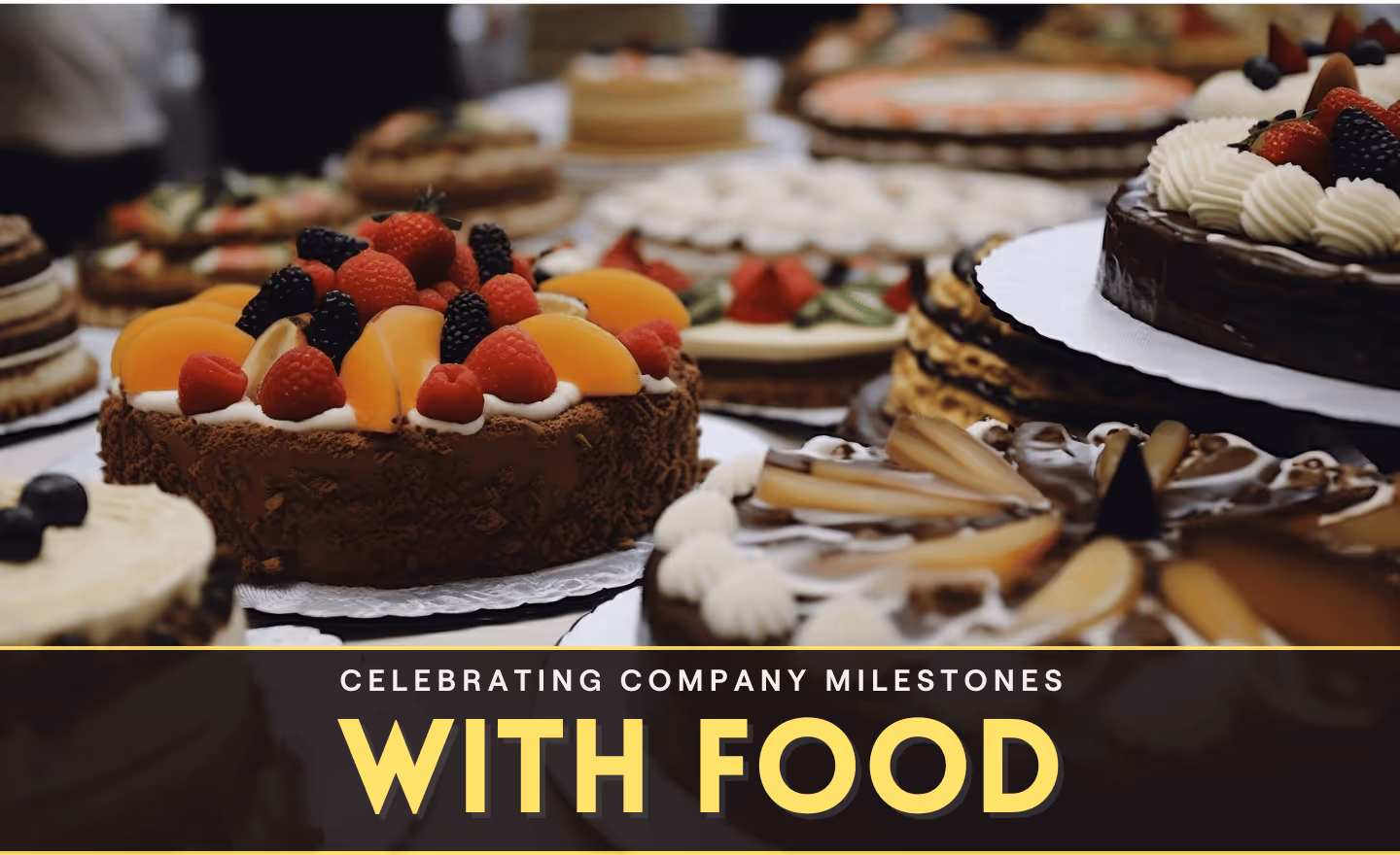 Team celebrating company milestone achievement with special catered meal and festive food celebration