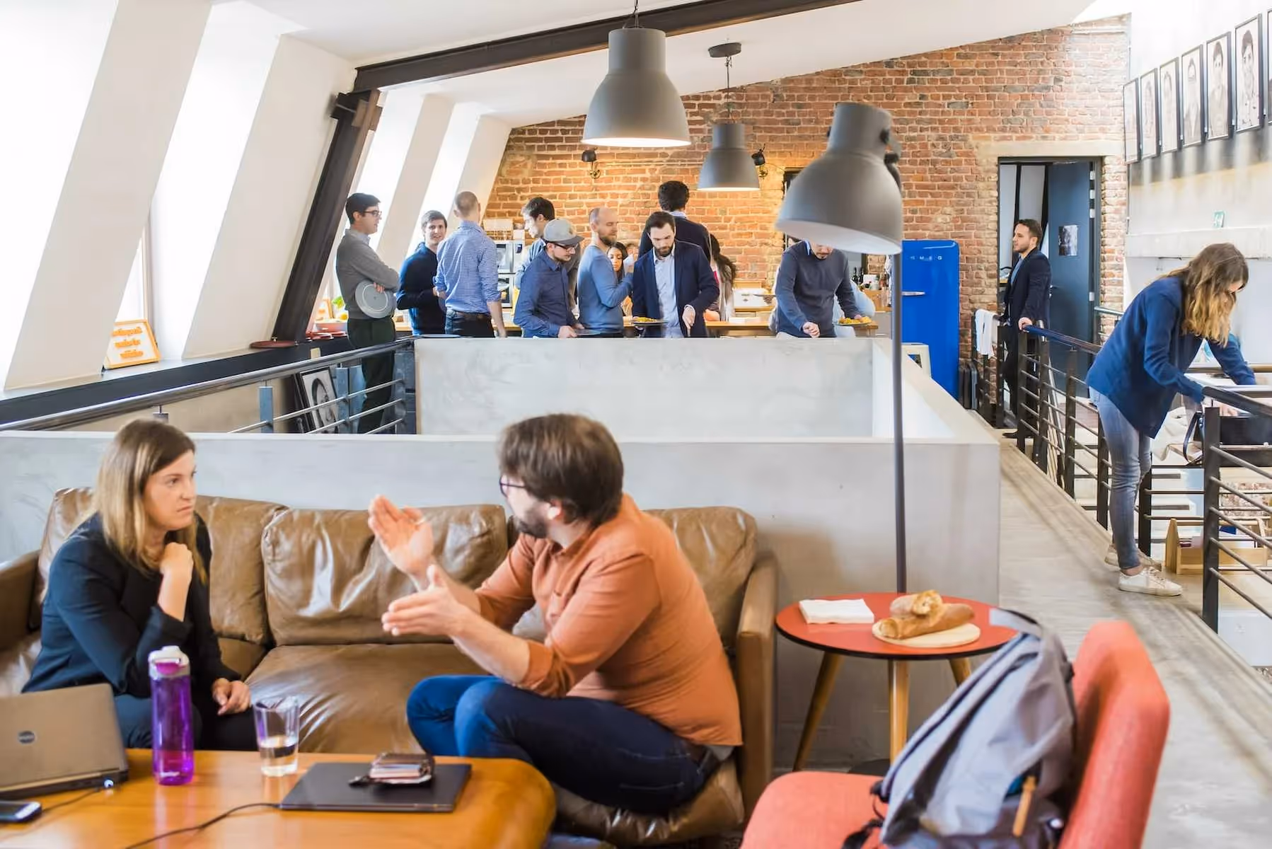 Excited employees returning to office with attractive workplace perks including meal benefits and modern amenities