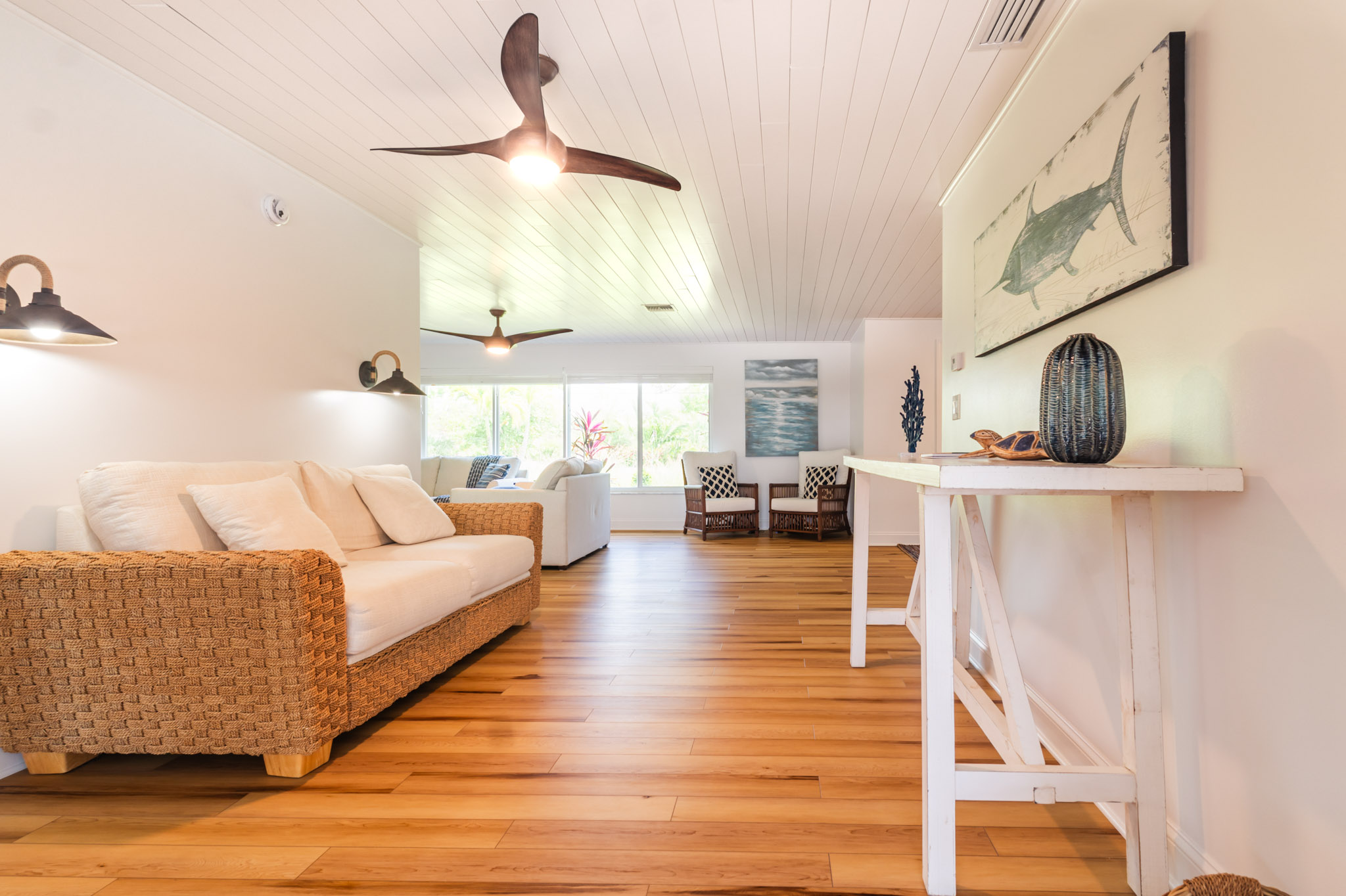 Open layout showing living and dining areas with plenty of light and natural textures.