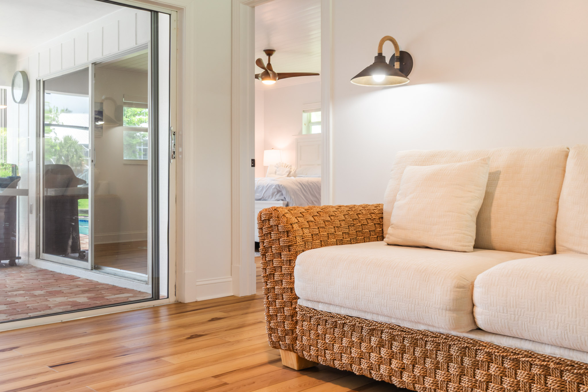 Bright sitting corner with natural light and soft beige armchair.
