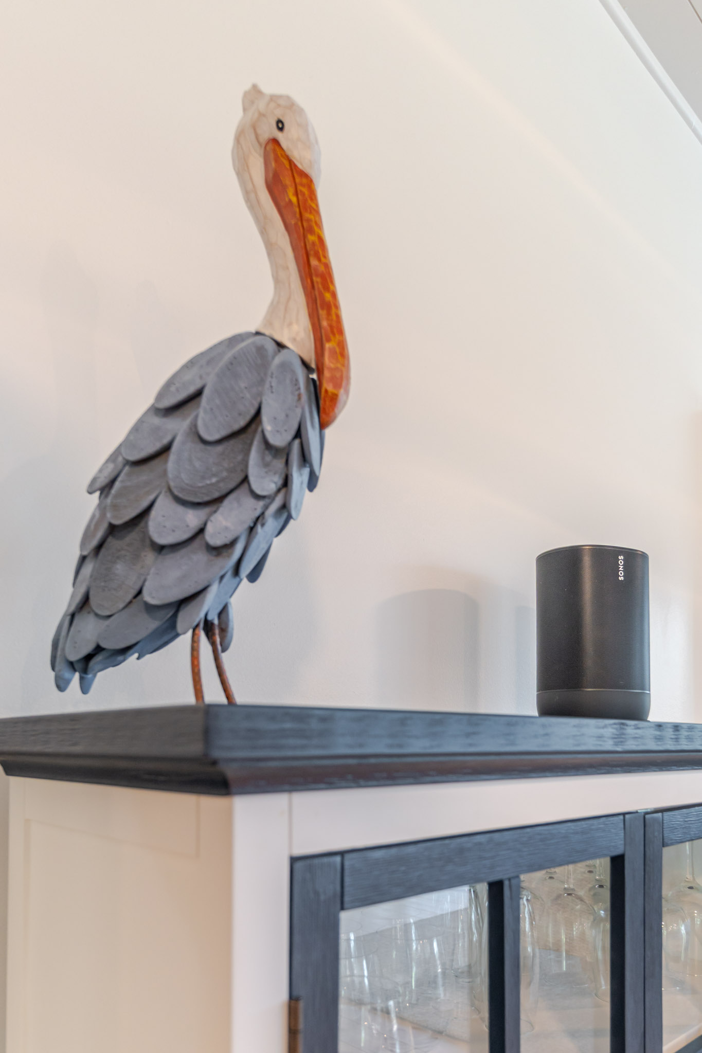 Pelican sculpture and minimalist decor in the dining area of a Sanibel Island vacation rental.