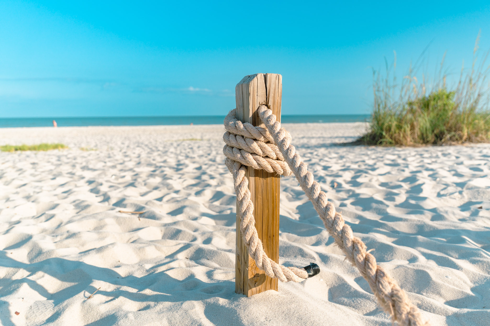 Wooden boardwalk over dunes to beach