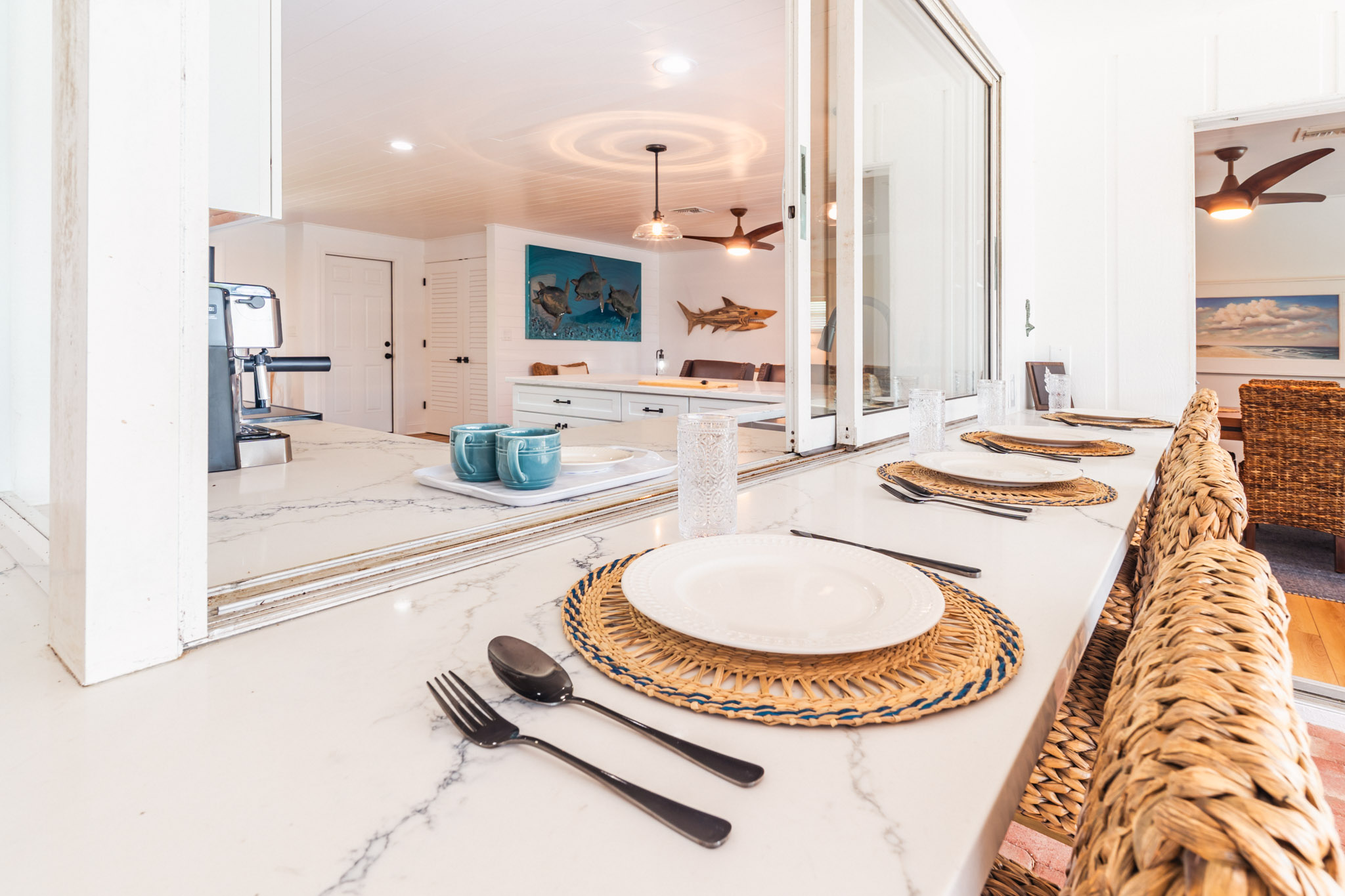 Dining setup near sliding doors with access to the outdoor patio at the Sanibel rental.

