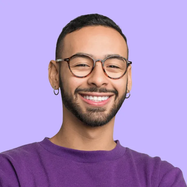 A man wearing glasses and a purple shirt.