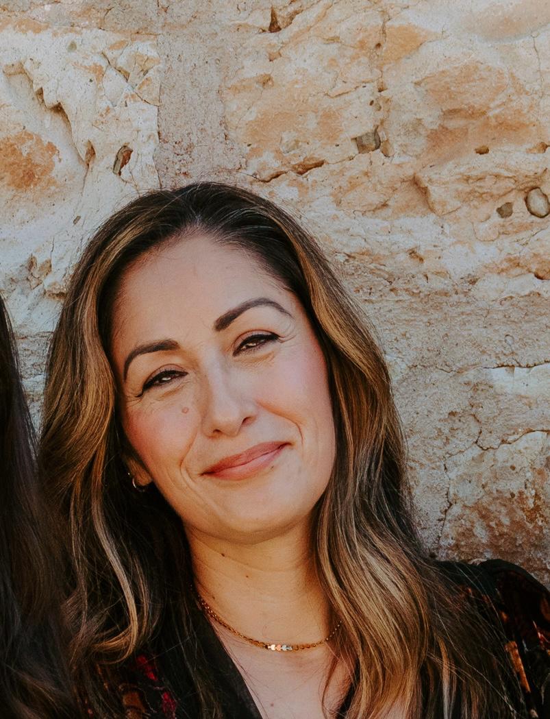 [headshot] image of satisfied student using a laptop, with modern simplicity emphasized