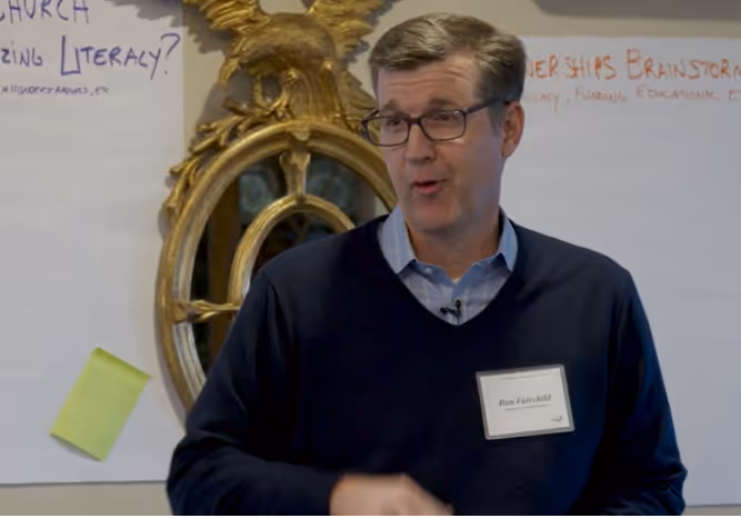 Photo of Ron Fairchild giving a lecture.