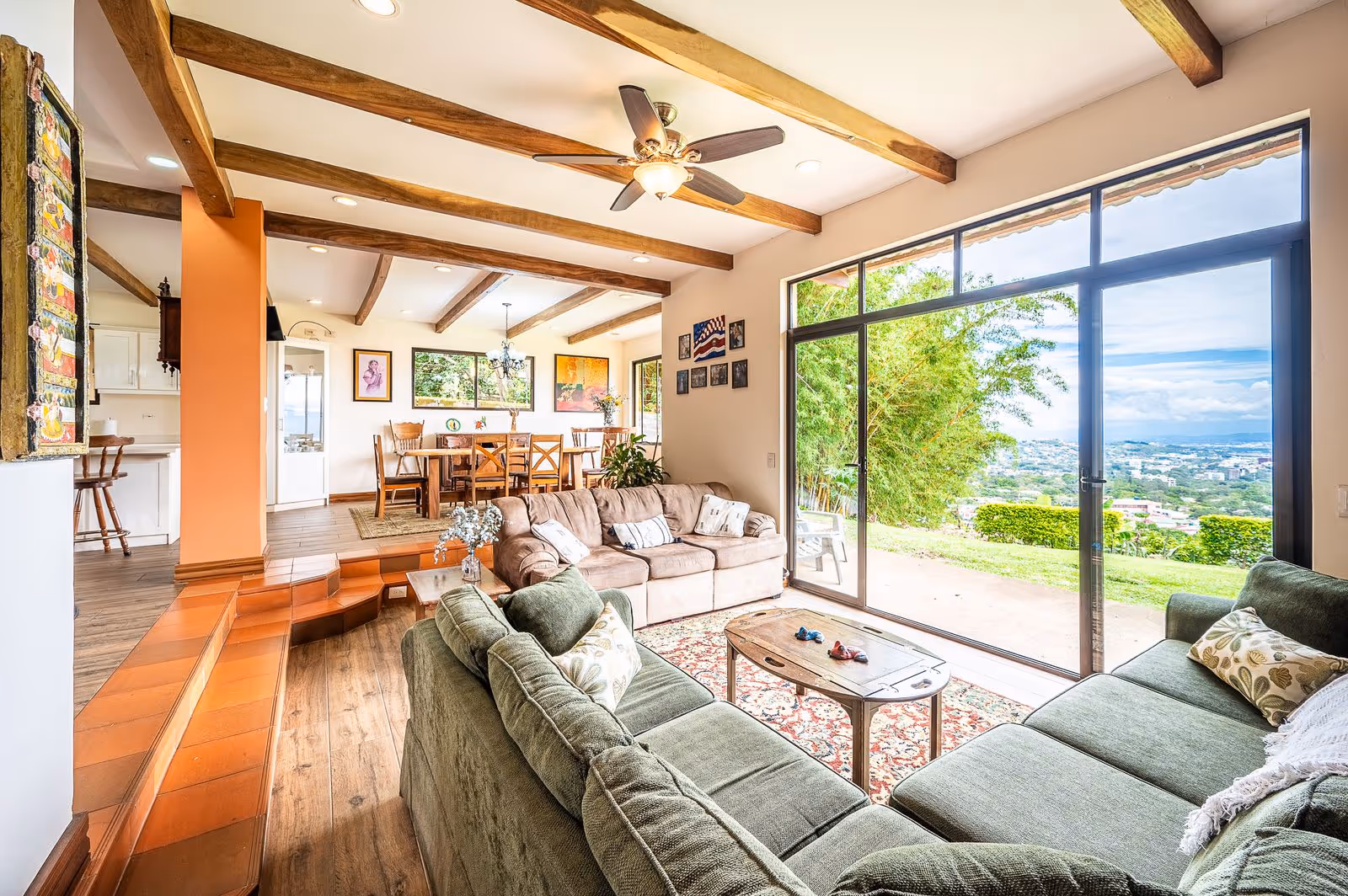 Open-concept living room with panoramic Escazú Valley views and upscale furnishings.