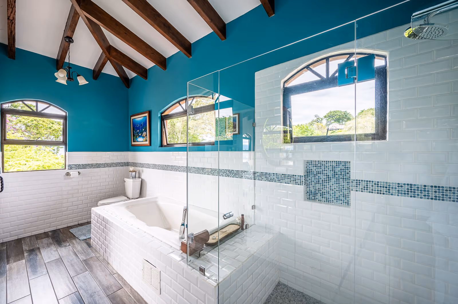 Designer bathroom with spa-like amenities and elegant tilework in Escazu property.