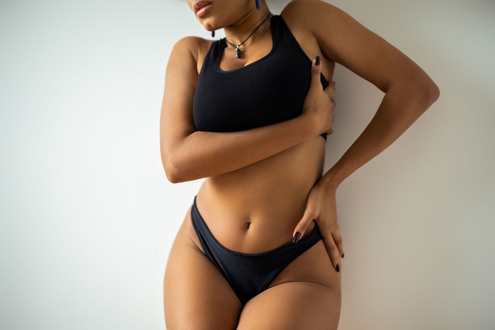 A woman in a bikini posing for a picture.