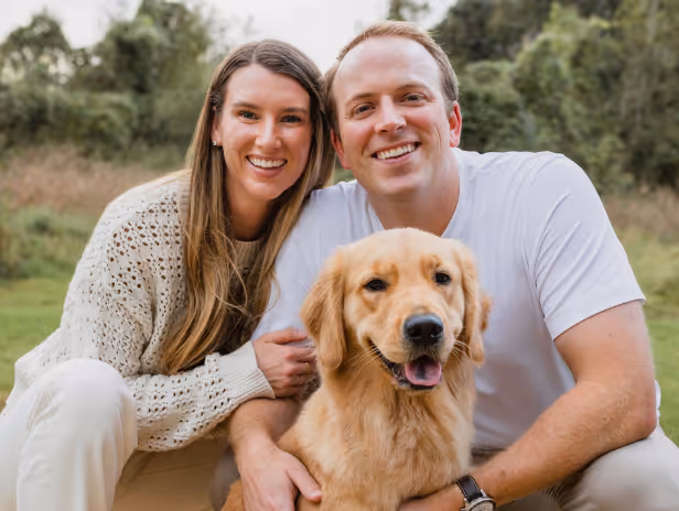 Family photo of Joe Ward, his wife, and dog.