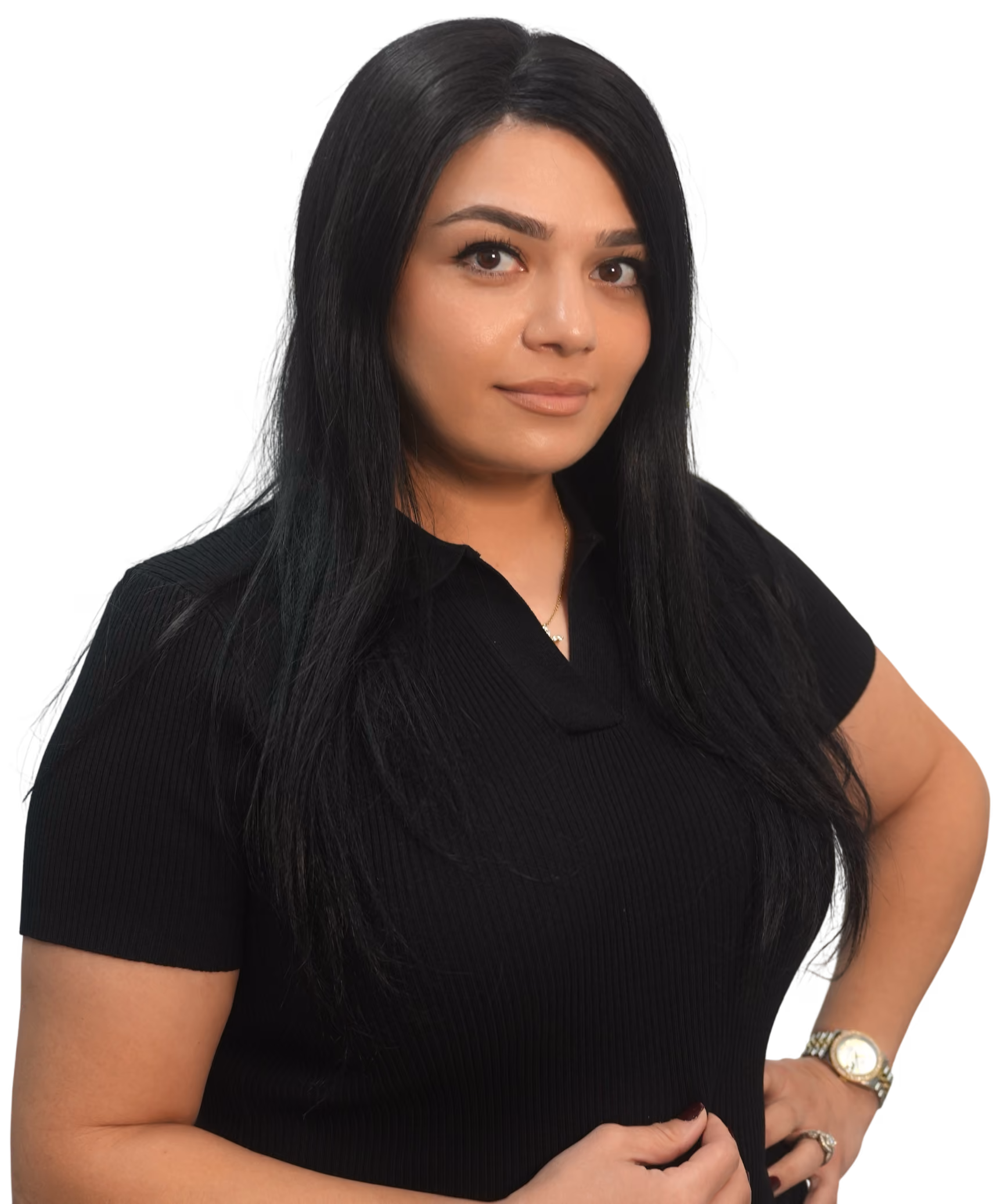 Portrait of a woman with long black hair wearing a black shirt, gold watch, and ring, posing with one hand on her hip and a slight smile.