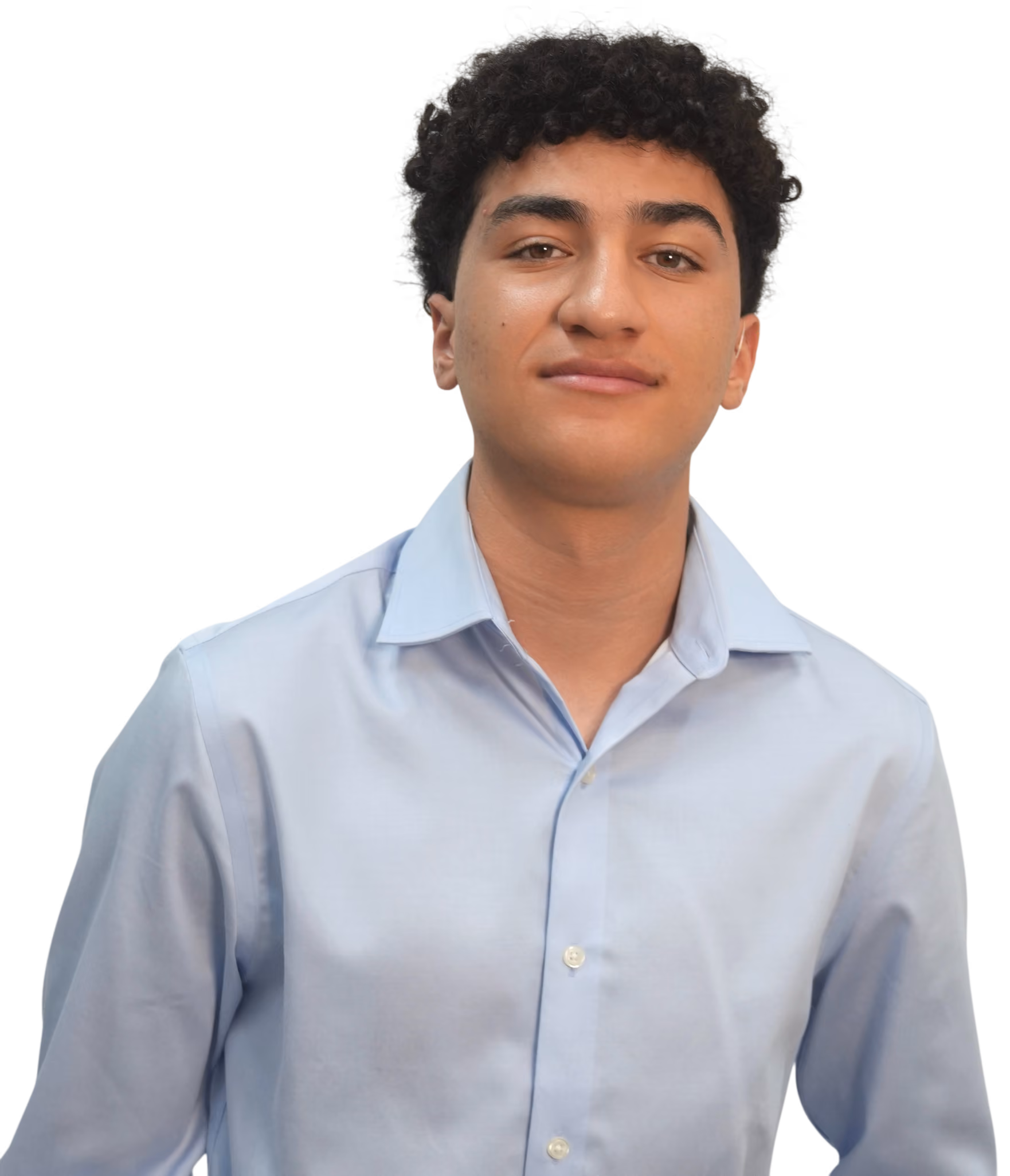Young man with curly black hair wearing a light blue button-up shirt, looking confidently at the camera.