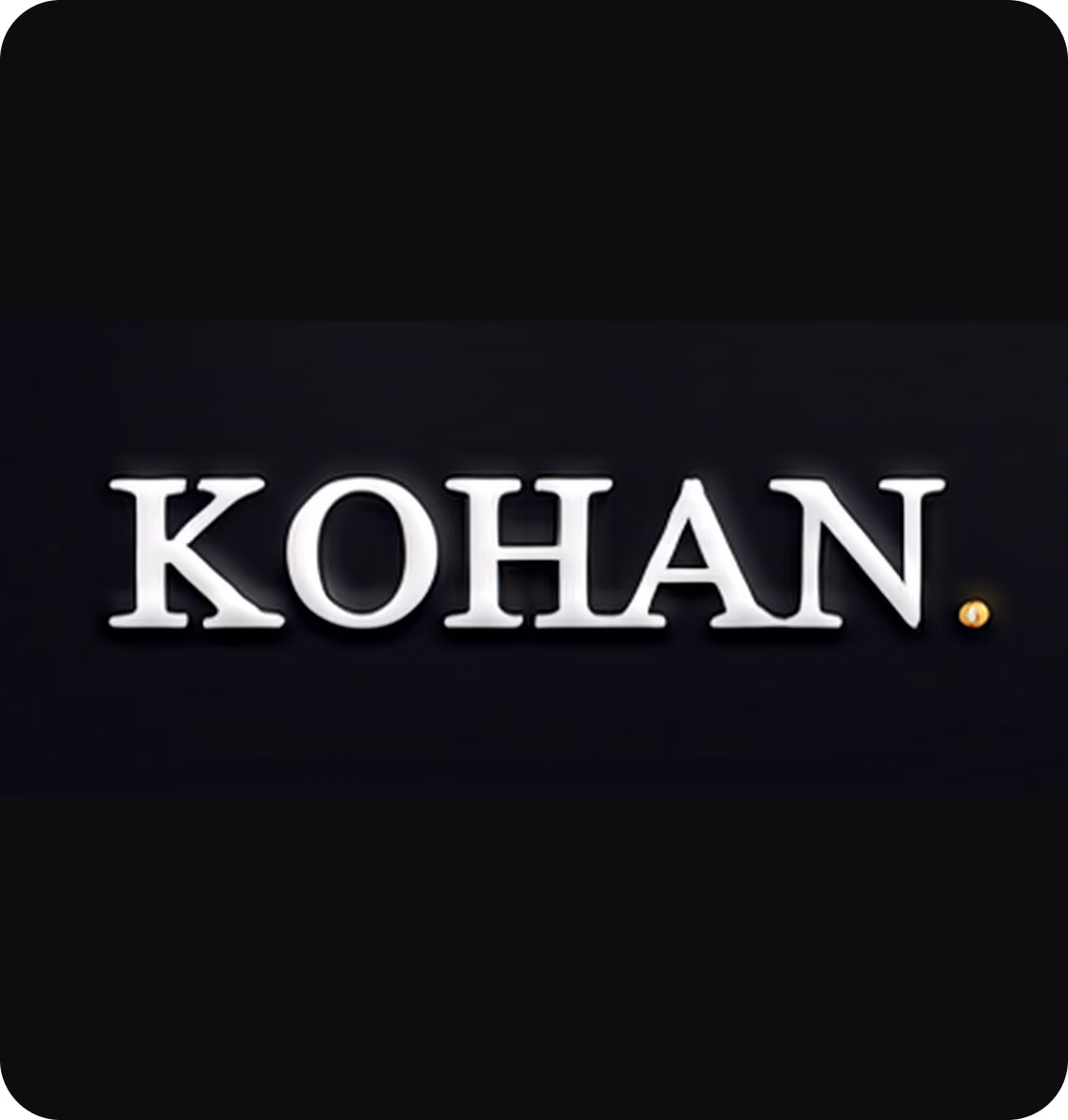 The word 'KOHAN' in capital white serif letters on a black background with a small gold dot at the end.