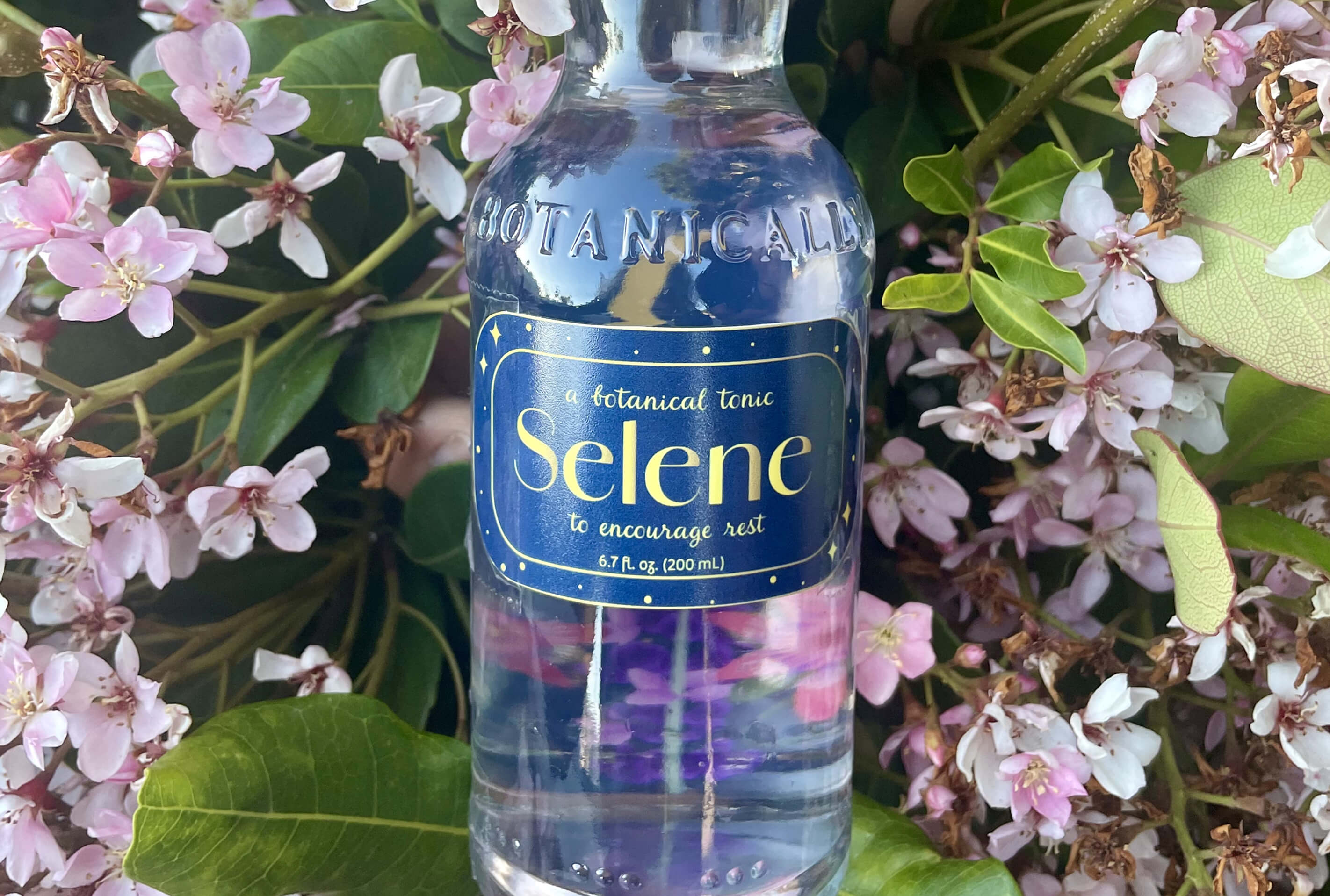 Beverage Packaging for Selene on a floral background. 