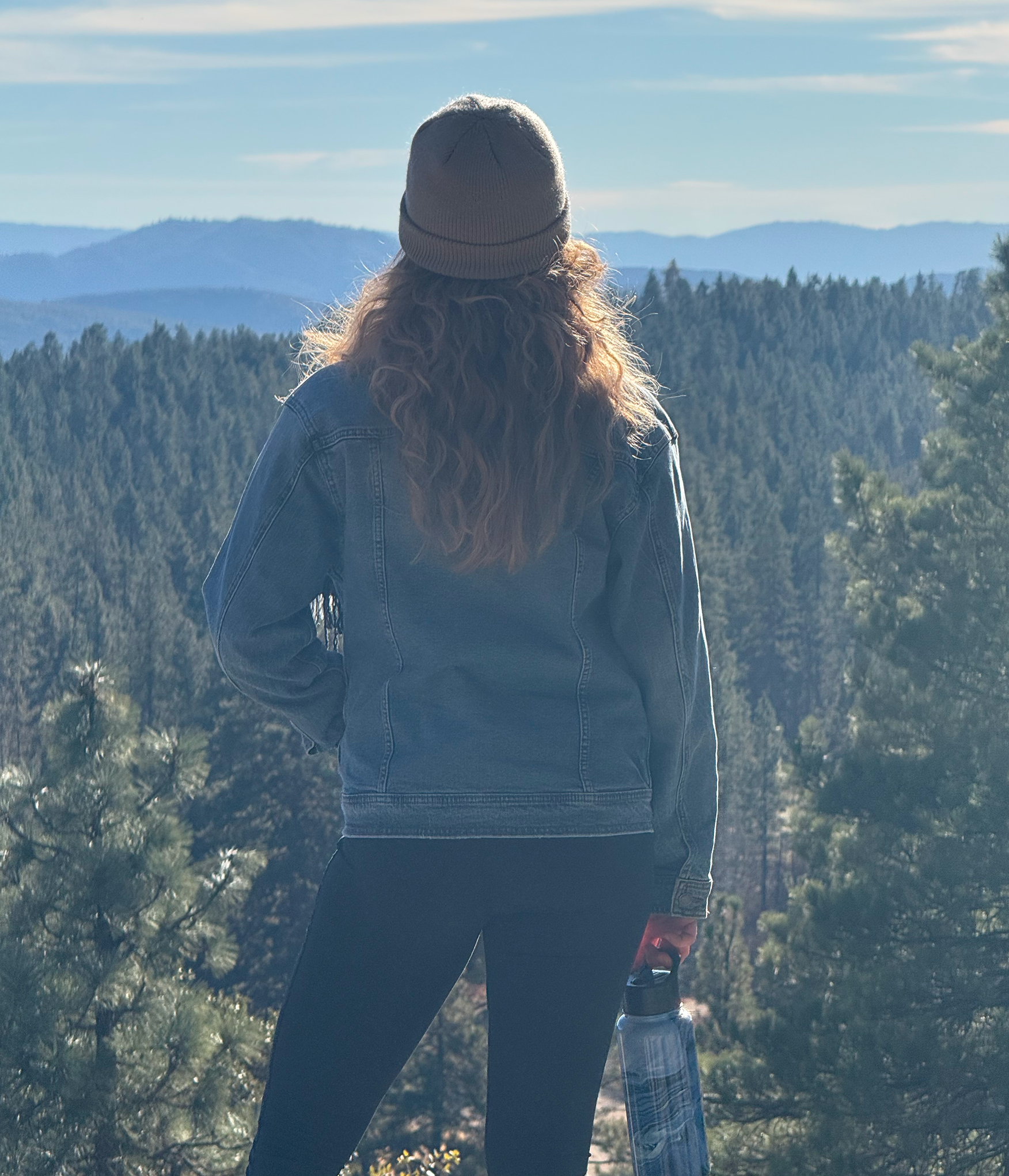 A picture of Marissa Hoffman looking out into nature. 