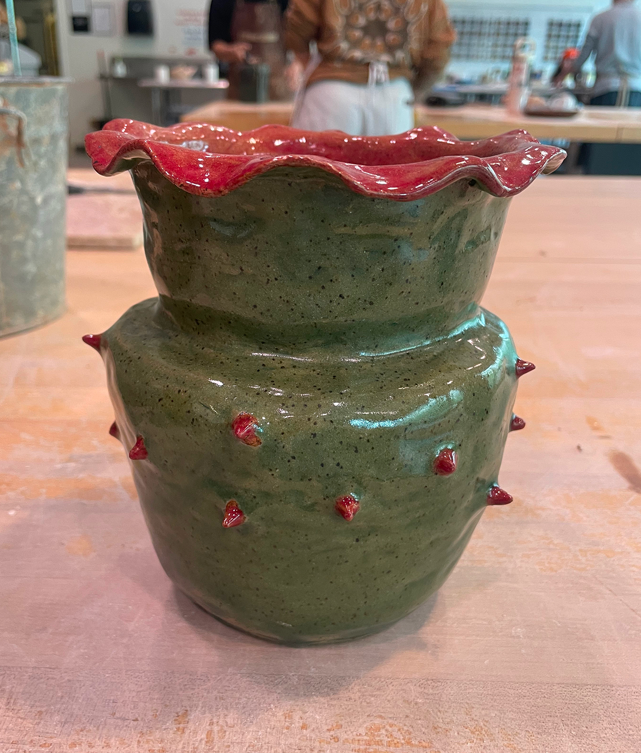 Green Vase with Red thorns made by Marissa