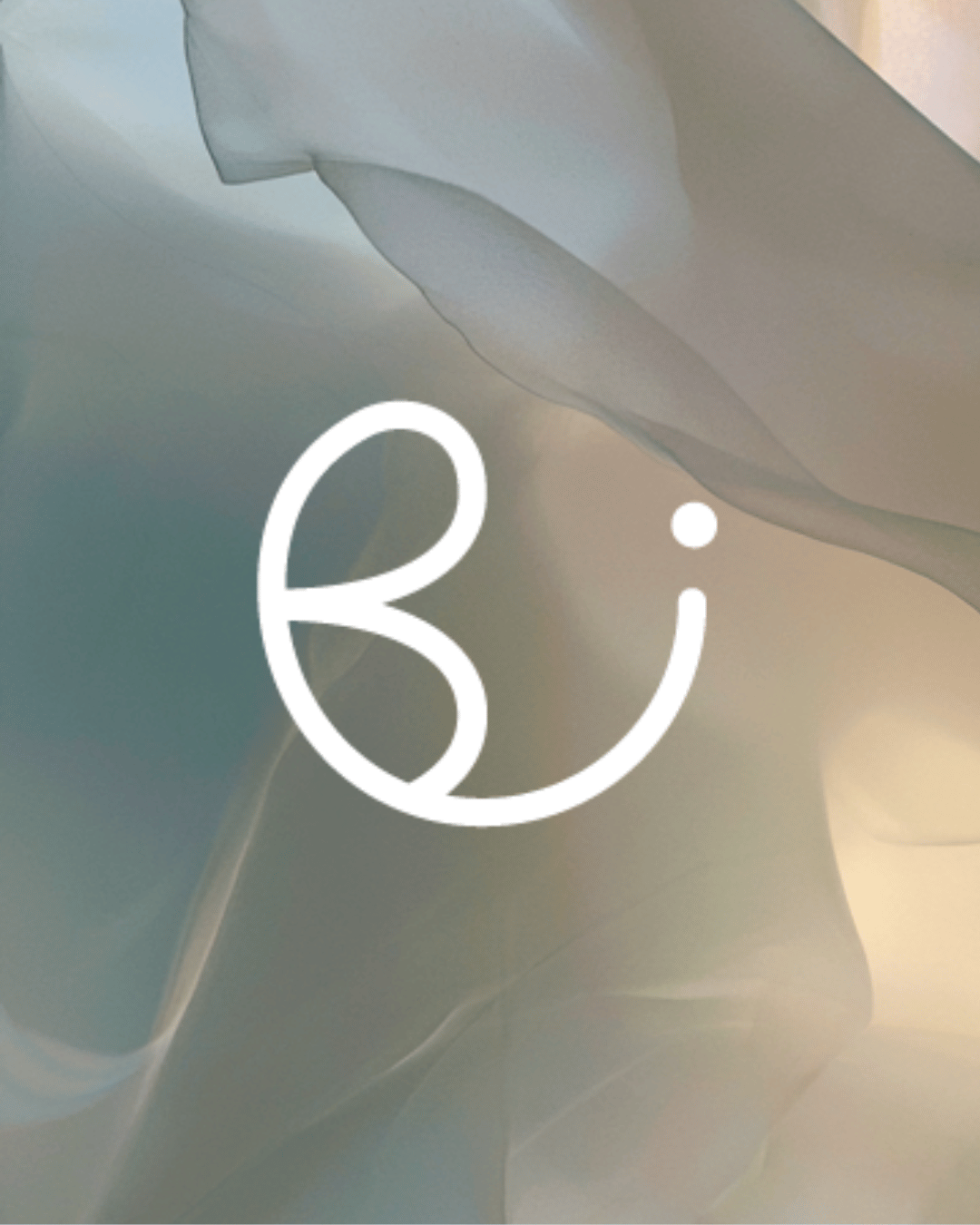 B monogram over soft draped silk