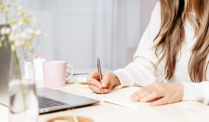 Visual of a woman journaling