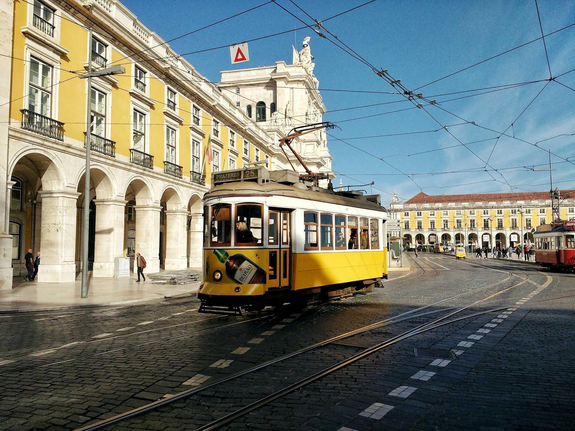 Tram train near Praça do Comércio Lisbon | Photo by Jack Niles on Unsplash