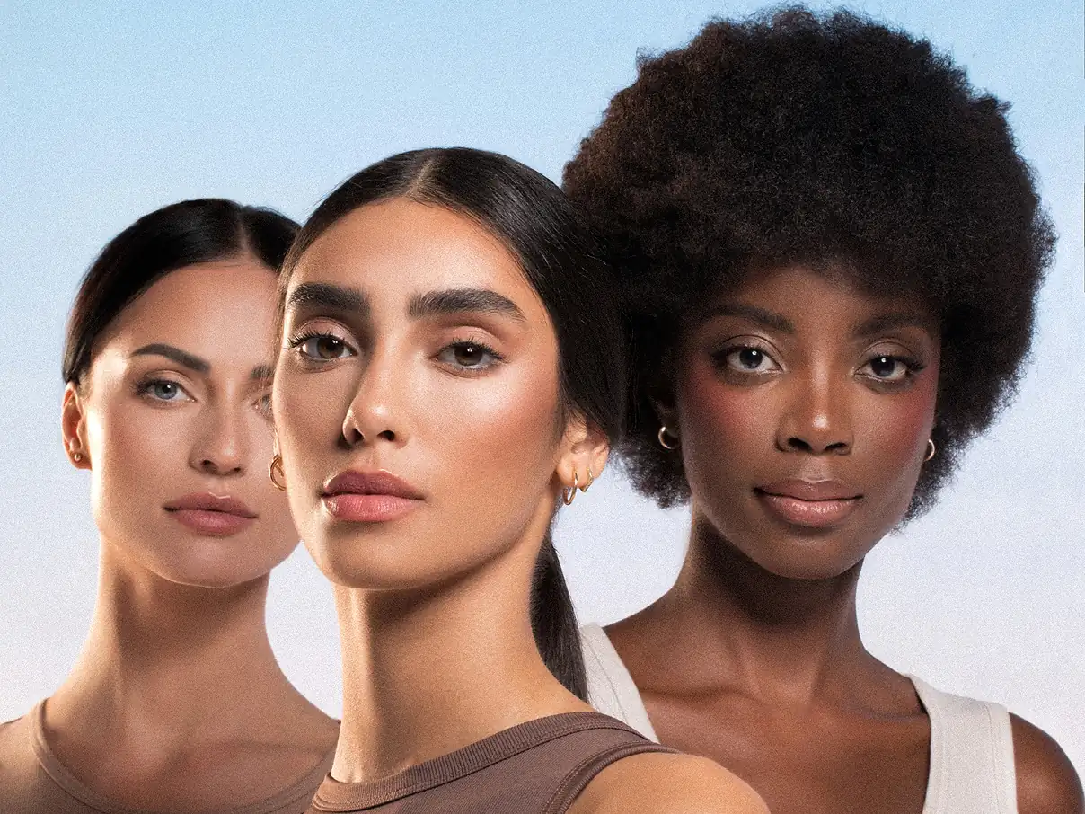 Closeup of 3 female models, wearing Asteri makeup.