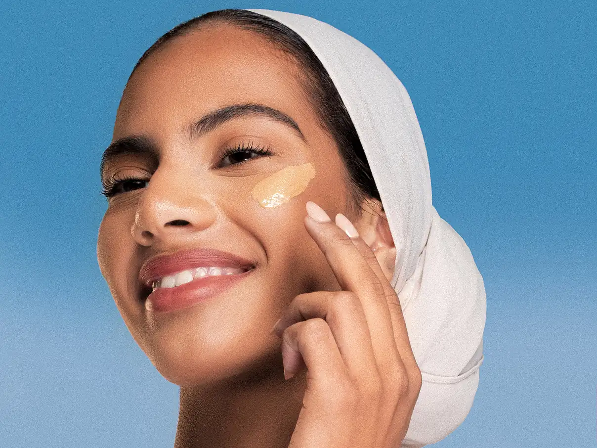 Closeup of a female model, applying Asteri makeup.