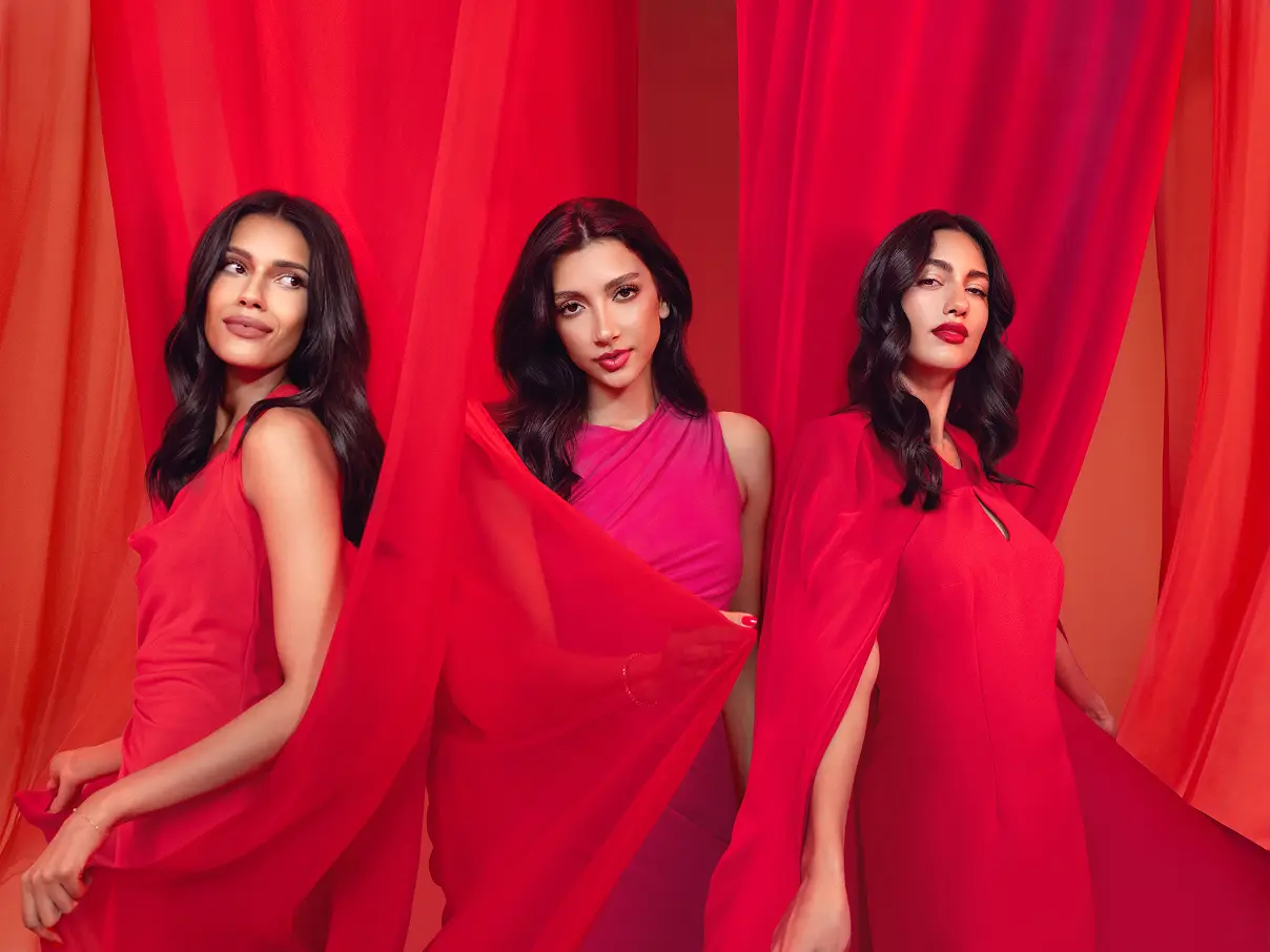 Three female models posing for the camera, wearing Asteri lipstick.