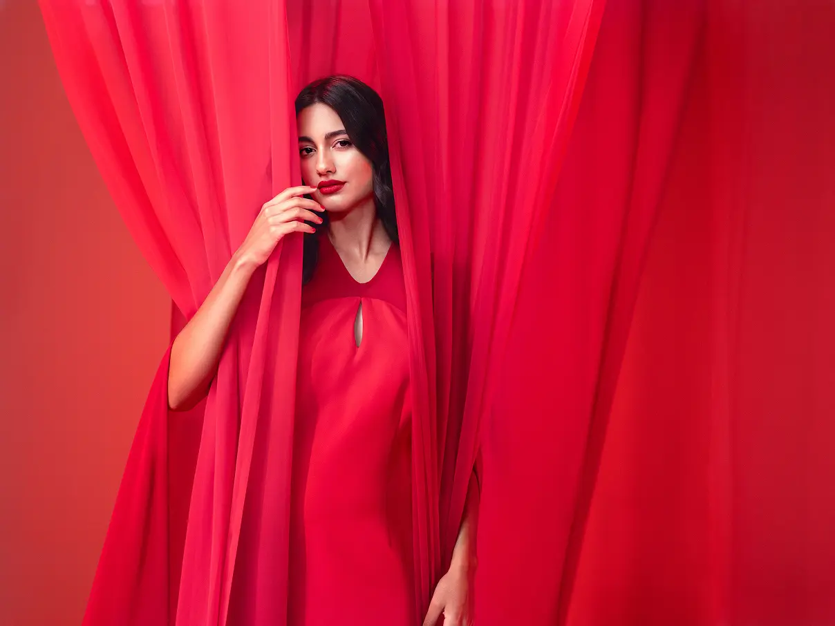 Female model posing for the camera, wearing Asteri lipstick.