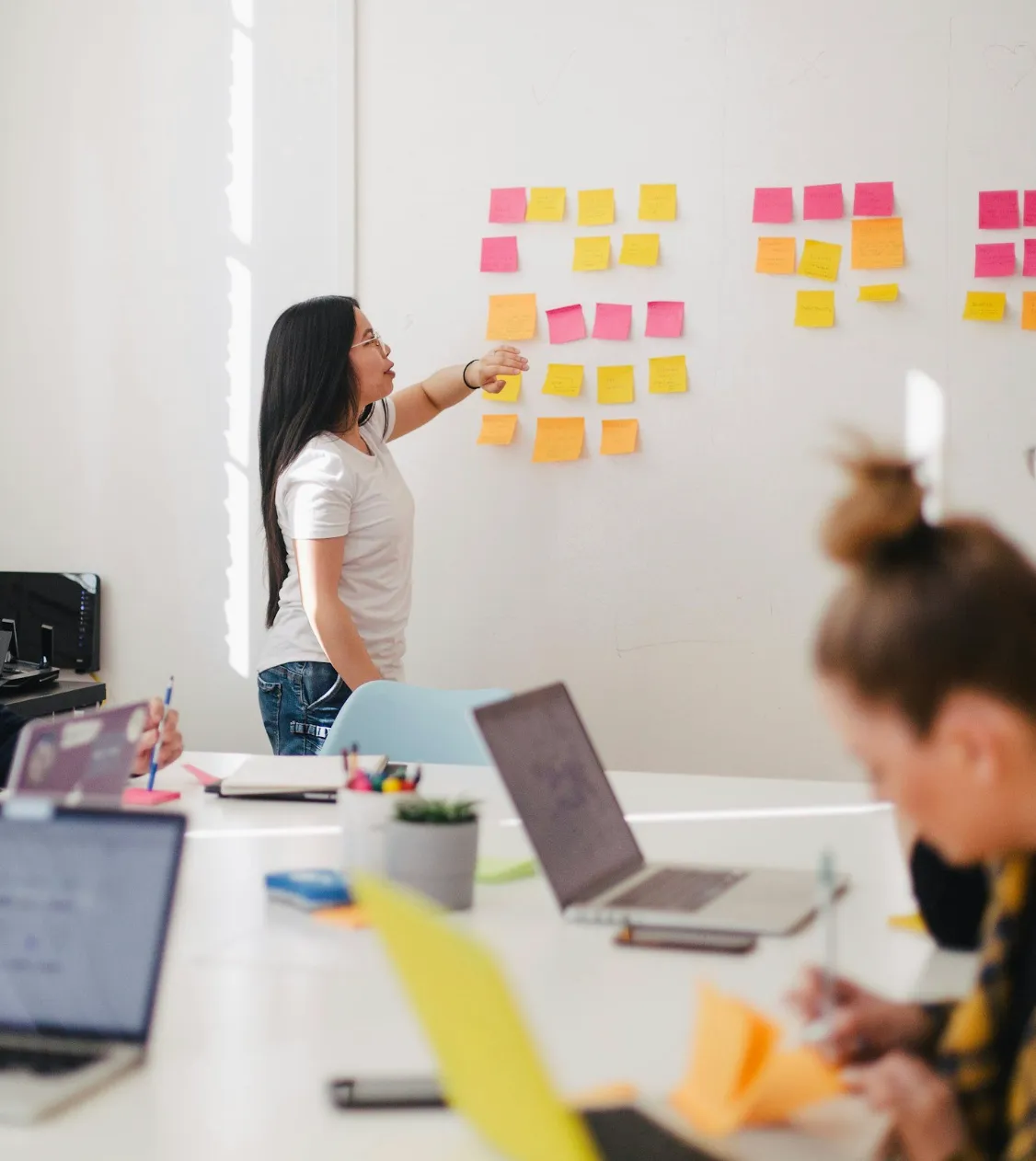 An executive leading her team through a coaching exercise