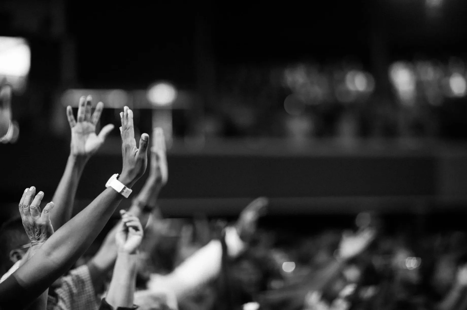 Black and white photo of people worshiping